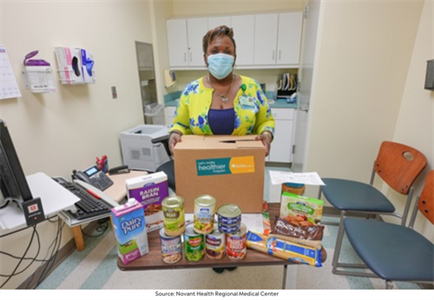 Trend 1_Aneschia Wiggins, RN with Food Pharmacy Box